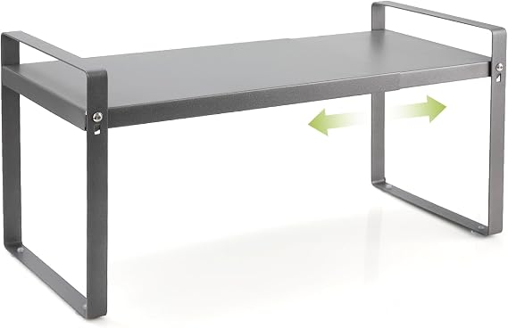 Estante gris Cozary con una balda extensible elevada sobre dos patas